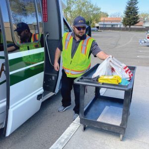 MTM Transit driver performs meal delivery. Our staff are performing MTM Transit meal delivery. Working with organizations like Central Texas Food Bank, we deliver meals to many in need.